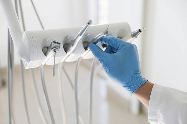 Professional Tooth Extraction technician working in George, IA